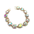 Gold-tone linked bracelet with rainbow-iridescent cushion-cut crystals
