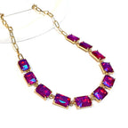 Gold-tone chain necklace with rectangular crystal links in fuchsia and purple AB color