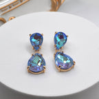 Gold-tone crystal teardrop dangle earrings with blue pear and oval stones