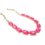 Gold-tone chain necklace with rectangular crystal links in bright pink AB color