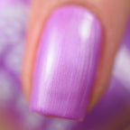 Satin purple nail polish on a single fingernail, glossy satin sheen.