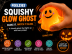 Light-up squishy glow ghost toy in orange, held in a hand with soft glow