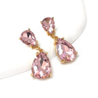 Teardrop dangle earrings with pink faceted stones and gold-tone links