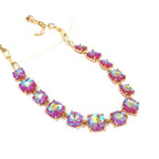 Gold-tone crystal necklace with pink and purple cushion-cut square stones