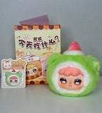 Green plush pendant with white hood, red strawberry top, and rosy cheeks