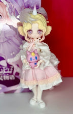 Ball-jointed collectible doll in pale pink dress holding a blue bunny plush