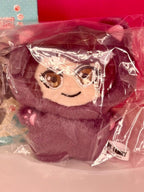Plush character pendant with brown hair, closed-mouth smile, and soft maroon outfit