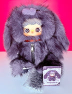 Purple-gray fuzzy plush backpack with hood and zipper, plus blind box card and bag