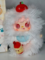 White plush cat face pendant with a red apple hat and blue checkered outfit.