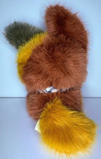 Fox plush back view with brown body, gray ear, and yellow star-shaped tail accents