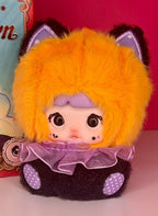 Orange plush blind box doll with purple hood ruffle and polka-dot accents