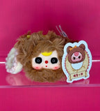 Brown plush hair scrunchie with cute face, yellow accent, and bear patch
