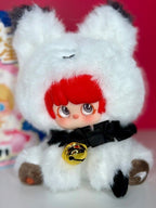 Plush designer blind box figure in white hood with red hair and black bow