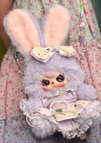 Lavender rabbit plush coin purse with bunny-ear pouch top, beaded strap, and embroidered face panel.