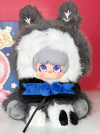 Plush designer blind box figure with dark gray bat-ear hood and blue bow
