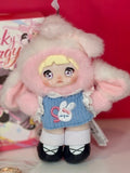 Plush blind box figure in pale pink hood with blue shirt and black shoes