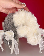 Grey-and-cream cloud plush bag charm side view with lace ribbons and dangling beads