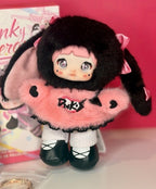 Plush blind box figure with black hair, pink dress, and black shoes