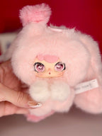 Pink cloud plush bag charm with swirl eyes and heart-shaped blush, small bunny style
