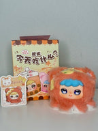 Orange plush pendant with blue hair and green leaf crown