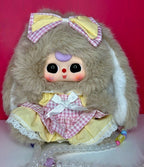 Green rabbit plush coin purse with pink checkered dress, bow headband, and lace trim hem.