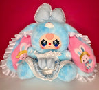 Blue-and-pink plush bunny doll with big glittery eyes and lace ruffle dress