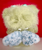 Light green plush bunny backside with blue inner ear accents and paw bows