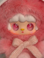 Pink fuzzy plush bear pendant with hood, rounded face, and tied bow detail