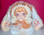 Kawaii plush doll in white fluffy hood with orange dress and ruffled white skirt