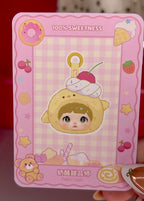 Plush pendant toy blind box illustration with tan hat and pink character hood