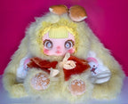 Lemon-yellow plush doll with bear-like hood, big eyes, red dress, hands posed
