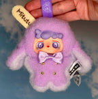 Purple plush doll with lavender bow, big eyes, and hanging Mitutu strap tag.