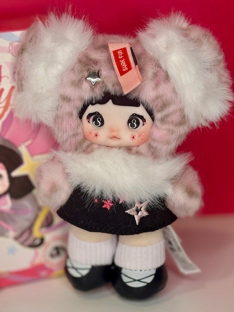 Light pink bunny-hood plush figure doll with black star dress and striped socks