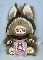 Brown and gray plush bunny with ruffled collar, printed face, and accessory
