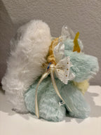 Plush doll with white fluffy back, mint body, gold ribbon accents and translucent tulle headpiece