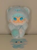 Light blue plush bear keychain with hooded outfit and smiling cartoon face