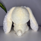 White bunny plush toy with long floppy ears and stitched feet
