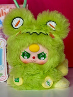 Green mini plush pendant with cute orange nose and big green eyes, hanging loop