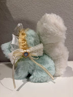 Side view crystal plush doll with mint fur, white fluffy wings, and bow ribbon detail