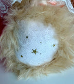 Collectible bunny plush light blue belly patch with small star accents.