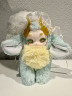 Mint plush doll front view with white tulle halo, yellow horns, ear wings and green eyes