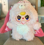Plush rabbit toy with pink hood, yellow nose, and glittery cartoon eyes