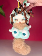 Kawaii plush angel blind box figure with teal outfit, brown wings, fluffy tail