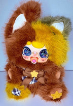 Fox plush with yellow and brown fur, blue glitter eyes, checkered paw and star charms