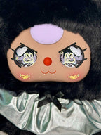 Close-up black plush face with pale purple hood, red nose, and printed eyes