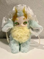 Mint crystal plush doll with yellow horns, white tulle hood, fluffy yellow chest and green eyes