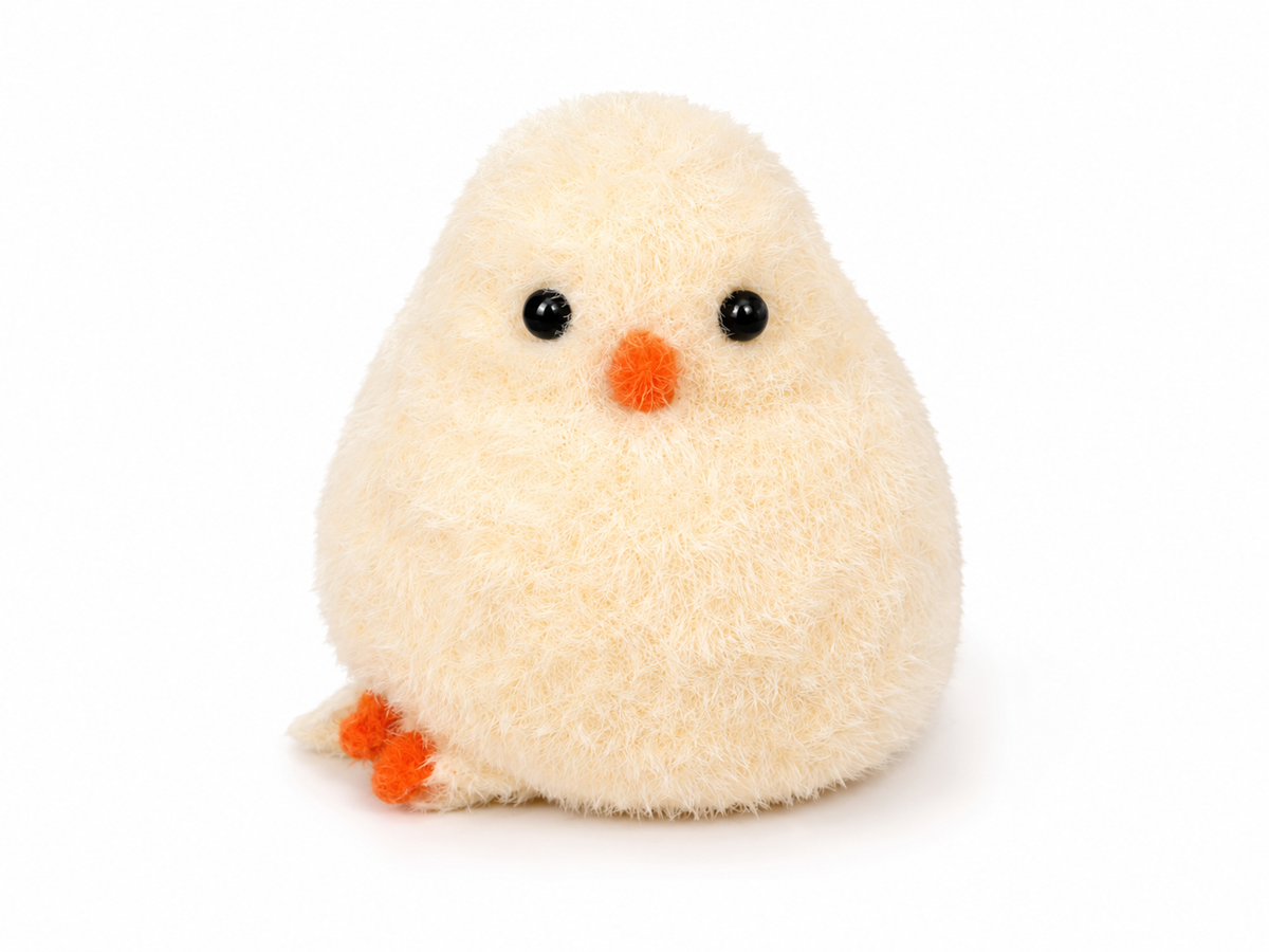 Fuzzy cream plush chick sensory squeeze toy with orange beak and black eyes