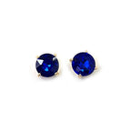 Round deep blue glass stud earrings with sterling silver posts and gold-tone settings