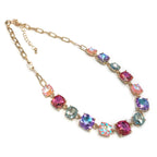 Gold-tone linked chain necklace with pink, purple, and teal cushion-cut crystal stones