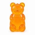Orange gummy bear slow rebound squishy fidget toy with bow-tie details
